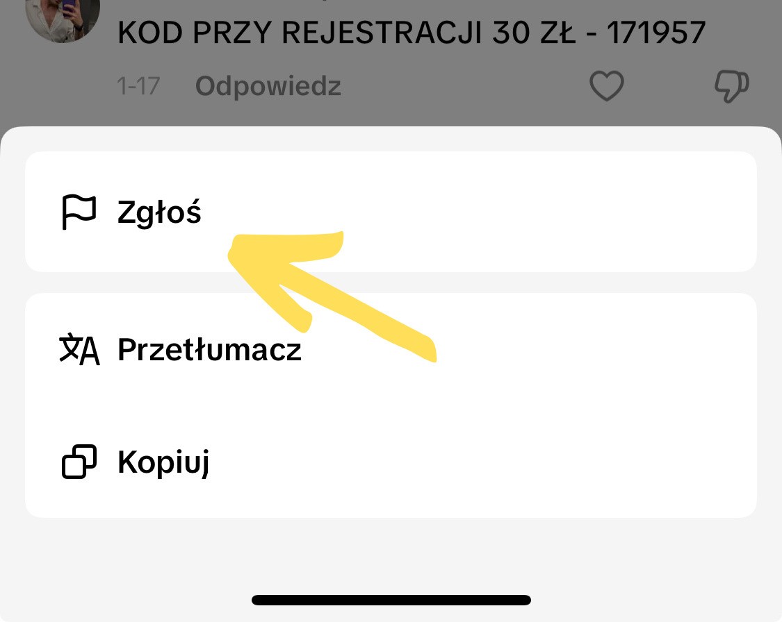 Interfejs sekcji komentarzy na TikToku. Widoczna jest opcja "Zgłoś".